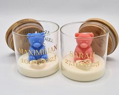 two small glass cups with teddy bears on them