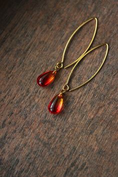 Lovely feminine earrings with red-yellow glass drop beads, gold tone stainless steel jumping rings, gold tone V shape stainless steel earring hooks. Earring hooks are from nickel free and lead free metal. *The total lenght of earrings is about 55 mm including earring hooks. Perfect jewelry for everyday wear! Other earrings of my shop you can see here: https://www.etsy.com/shop/NaTavelli?section_id=13757927 Thank you for visit! Red Handmade Drop Earrings, Red Long Drop Earrings With Ear Wire, Unique Handmade Red Earrings, Red Pierced Drop Earrings, Gold And Red Earrings Dangle, Cowrie Shell Jewelry, Feminine Earrings, Glass Drop Earrings, Fancy Jewellery