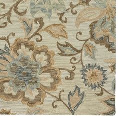 an area rug with flowers and leaves on it