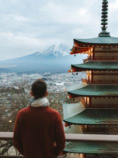 a man standing on top of a tall building