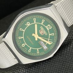 THE MOVEMENT HAS BEEN RECENTLY SERVICED AND IS KEEPING PERFECT TIME ,THE WATCH HAS BEEN REFURBISHED TO LOOK LIKE NEW . DIAL HAS BEEN RE-PAINTED , CASE BACK HAS BEEN POLISHED AND A NEW STRAP HAS BEEN INSTALLED. SEE THE PHOTOGRAPHS FOR ANY DEFECTS VINTAGE SEIKO 5 AUTOMATIC 6309A JAPAN MENS DAY/DATE GREEN DIAL WATCH 568e-a302103-1 Vintage (1971-1983),Men,Seiko,Automatic,Day & Date, Professionally repainted dial, Stainless steel case and back,Will install a new glass/crystal before dispatch if needed,Mechanical: Automatic,Japan, Analog,Band width - 18mm,  8.0 inches fit to wrist (contact us for bigger wrist), It is in ready to wear condition,6 months seller warranty (contact seller to claim it). Water resistant : No Vintage Green Automatic Watch, Vintage Green Watch With Round Dial, Vintage Green Analog Watch Accessories, Mens Day, Seiko 5 Automatic, Seiko Automatic, Seiko 5, Glass Crystal, Wristwatch Men