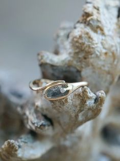 a close up of a ring on a rock