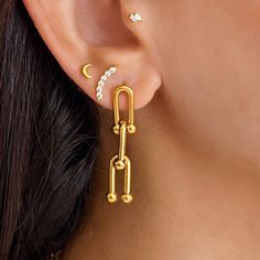 Ursula Hardware Earrings in Gold.  * 18K Gold plated. * Tarnish free.  * 1 Year Warranty. * Free Shipping STYLE TIP * A stunning hardware chain dangles elegantly on your ear, adding a touch of sophistication to your look. * Style with a cute top and knit pants for summer. Looks great stacked with dainty studs and slinky gold chains.  * Size: 40mm.  MATERIAL * 18K Gold plated. * Finely crafted in stainless steel CARE INSTRUCTIONS * Tarnish free. * Please remove hoops before shower, swim and exerc Gold Sterling Silver Tarnish Resistant Plug Earrings, Gold Hypoallergenic Dangle Plug Earrings, Everyday Gold Linear Pierced Earrings, Dainty Gold Hypoallergenic Plug Earrings, Hypoallergenic Gold Linear Earrings In Sterling Silver, Dainty Gold Dangle Plug Earrings, Yellow Gold Link Earrings For Gift, Yellow Gold Link Earrings As Gift, Gold-plated Link Earrings