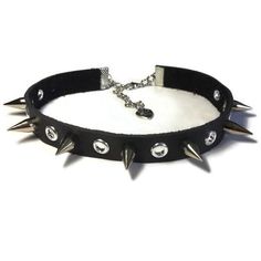 SimplyRozi | Spike And Grommet Leather Choker - Black | $9.75 | Choker, Punk Choker, Rocker Choker, Gothic Choker, Choker Collar, Leather Choker, Thin Black Choker | This is a hand cut and studded black soft leather choker. It is 11 1/2 inches long and 1/2 inch wide. I have finished the edges with a silver leather end crimp and added a silver claw and extension chain which makes it 15 inches long...thus it will fit a neck which is between 11 1/2 and 15 inch neck... | etsy.com Punk Choker, Emo Jewelry, Gothic Choker, Choker Black, Gothic Chokers, Scene Girls, Emo Outfits, Leather Chokers, Black Choker