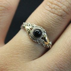 This is a vintage Sterling Silver 925 ring with 14k Yellow Gold plated detail. Set center is a Black Onyx stone. Available in sizes 4, 5, 6,7 Victorian Black Sterling Silver Rings, Victorian Style Black Sterling Silver Rings, Black Victorian Rings With Polished Finish, Victorian Black Rings With Polished Finish, Victorian Style Black Rings With Polished Finish, Vintage Onyx Ring Jewelry, Vintage Onyx Black Rings, Black Sterling Silver Vintage Rings, Vintage Black Sterling Silver Rings