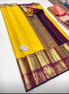 The saree is made of pure silk kanjeevaram/kanchipattu with gold zari, Pallu, and blouse. Various Colours Available, please see photos. Mention desired colour in "Optional Note" when purchasing saree. ❗️❗️❗️PLEASE CONTACT SELLER TO CONFIRM COLOUR COMBINATION FOR AVAILABILITY ️❗️❗️ Upon request: Tussels, fall and pico and blouse work (Aari work and Maggam work) will be done with extra charges  Excellent quality with beautiful colours and combinations. Gold Tussar Silk Saree Silk Mark Certified, Gold Silk Mark Certified Saree For Puja, Gold Silk Mark Certified Saree For Festivals, Gold Silk Saree With Silk Mark Certification, Yellow Tilla Saree For Puja, Ceremonial Paithani Silk Saree With Tilla Detailing, Gold Traditional Wear Silk Mark Certified For Festivals, Gold Silk Mark Certified Saree For Wedding, Yellow Saree With Tilla For Puja