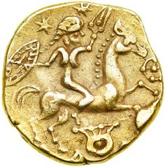 a gold coin with an image of a man riding a horse