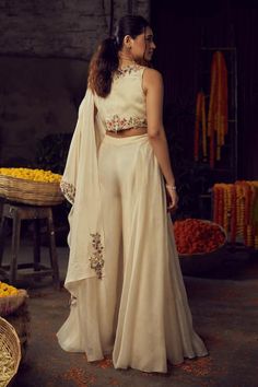 Buy White Organza And Silk Embroidery Thread V Neck Floral Blouse Sharara Set For Women by Nehha Nhata Online at Aza Fashions. Beige Set With Intricate Embroidery And Traditional Drape, Wedding Palazzo Set With Floral Embroidery In Raw Silk, Cream Sets With Floral Embroidery For Transitional Season, Transitional Floral Embroidered Cream Sets, Transitional Cream Sets With Floral Embroidery, Transitional Off-white Sets With Floral Embroidery, Wedding Chanderi Palazzo Set With Floral Embroidery, Traditional Drape Sets With Floral Embroidery In Cream, Cream Sets With Floral Embroidery And Traditional Drape