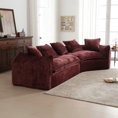 a living room filled with furniture and a rug