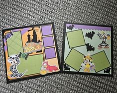 two mickey mouse halloween cards sitting on top of a carpet