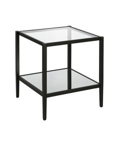 a glass and metal side table with one shelf on the bottom, against a white background