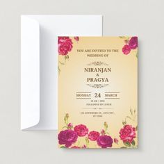 a wedding card with pink flowers on the front and yellow back, in an ornate frame