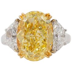 This gorgeous 10.03 carat fancy yellow diamond is like wearing a piece of sunshine! Exceptionally sparkly and with beautifully vibrant color, this is a truly magnificent piece. Graded by GIA as a fancy yellow color and VS2 clarity, the center diamond is set in 18K yellow gold so the prongs will disappear against the stone. Two half moon diamonds which total 2.41 carats provide brilliance contrast against the yellow center diamond. The rest of the setting is crafted in platinum with an open, airy Dig Jewelry, Asscher Cut Diamond Ring, Big Diamonds, Fancy Yellow Diamond Ring, Radiant Cut Diamond Ring, Green Diamond Rings, Fancy Diamond Ring, Canary Diamond, Yellow Diamond Ring