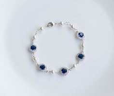 Bridal Bracelet Blue Sapphire Bridal Bracelet Something Blue | Etsy Elegant Blue Pearl Bracelet, Elegant Blue Round Pearl Bracelet, Adjustable Blue Crystal Bracelet For Wedding, Elegant Blue Beaded Bracelets For Formal Occasion, Blue Elegant Beaded Bracelets For Formal Occasions, Adjustable Blue Beaded Bracelets For Wedding, Adjustable Sapphire Bracelets For Wedding, Formal Blue Round Crystal Bracelet, Blue Round Beaded Bracelets For Wedding