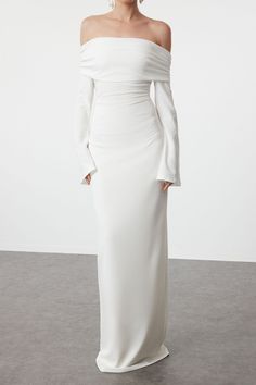 DescriptionThe ALESSIA Off Shoulder Maxi Dress in White is a timeless piece that exudes elegance and sophistication. This stunning gown features a sleek off-shoulder design with long, bell sleeves that add a touch of drama. The figure-hugging silhouette enhances your natural curves, while the floor-length hemline creates a graceful, elongated look. Perfect for formal events, weddings, or special occasions, this dress ensures you make a memorable entrance. Features • Off-shoulder neckline • Long bell sleeves • Figure-hugging silhouette • Floor-length hemline • Invisible zipper at the back • Smooth and stretchy fabric for a comfortable fit • Fully lined Care Instructions • Hand wash cold • Do not bleach • Do not tumble dry • Dry flat in shade • Cool iron on reverse if needed • Do not dry cle White Off The Shoulder Long Sleeve Dress, White Maxi Off-shoulder Dress For Party, Elegant Off Shoulder Long Sleeve Dress For Evening, Elegant Long Sleeve Off Shoulder Evening Dress, Chic Off-shoulder Floor-length Wedding Dress, White Fitted Off-shoulder Dress With Long Sleeves, Chic Off Shoulder Floor-length Wedding Dress, White Off-shoulder Evening Maxi Dress, White Off-shoulder Maxi Dress For Evening