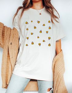 Matching sweatshirt: https://peachleafstore.etsy.com/listing/1046614652 ❀ Design is printed directly onto the t-shirt. ❀ More color options might be available upon request.  ❀ Size up if you want it oversized. ❀ The sizing is unisex. For garment measurements, please take a look at the size guide included in the listing images. Washing instructions to best preserve the print: ❀ Wash inside out using mild detergent, on a low temperature setting.  ❀ Let hang dry (do not tumble dry). Shop Homepage: Fun White T-shirt For Fall, Fun Custom Print Tops For Fall, White T-shirt With Funny Print For Fall, White Custom Print Shirt For Fall, Candy Corn Shirt, Corn Shirt, Halloween Shirts For Women, Last Minute Halloween Costume, Small Business Design