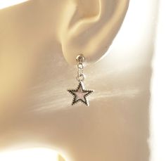 "Antique silver tone star charm earrings. Small star charms dangling from stainless steel ball earring studs. Earring length: 23mm; 0.9\" (including the ball of the stud) Earring stud material: stainless steel Charm material: Zinc alloy, Nickel safe, Lead free This listing is for one pair of star earrings with rubber backs. This earring will come in a gift bag. I offer combined shipping costs which give you a shipping discount for ordering multiple items from my shop. Earrings care: Take them of Ball Stud Earrings, Dope Jewelry, Funky Jewelry, Jewelry Inspo, Dream Jewelry, Star Charms, Ear Jewelry, Pretty Jewellery, Star Earrings