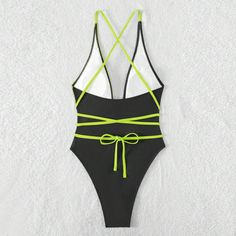 Elevate your beachside allure with our sleek and seductive one-piece swimsuit. Crafted with a minimalist design, this swimsuit features sensual straps that accentuate your curves with an air of sophistication. The premium fabric offers comfort and support while ensuring a flattering fit. Whether lounging by the pool or strutting on the sands, this swimsuit embodies pure elegance and confidencePattern: Solid colorWith or without steel support: With padded cups, no underwireColor: BlackSize: S, M, Dance Sports, Sports Swimming, Swimsuit Pattern, Pure Elegance, Sports Fashion, Black Swimsuit, The Pool, Sport Fashion, One Piece Swimsuit