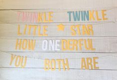 the words twinkle, twinkle little star, how one defiful you both are written on wood planks