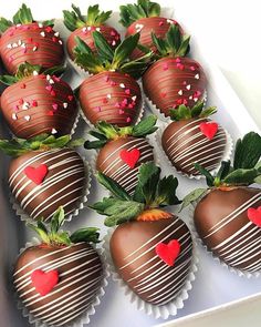 chocolate covered strawberries with hearts on them in a white box for valentine's day