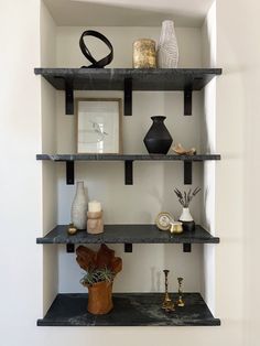 shelves with vases and other decorative items on them