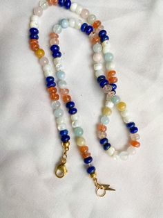 This beautiful rainbow gemstone necklace makes a perfect gift! Each bead is hand knotted onto silk thread, which gives the necklace a lovely drape. Necklace is 19 inches long, hand knotted with white silk string and has gold filled findings. This is a stunning necklace that completes any outfit. This necklace is a perfect gift!   GEMSTONES INCLUDED: Lapis Lazuli Mother of Pearl Shell Sunstone Morganite BENEFITS OF A HAND KNOTTED NECKLACE 1. A knotted necklace is safe and secure. If it should get Luxury Adjustable Rondelle Beaded Necklaces, Handmade Multicolor Rondelle Crystal Necklaces, Rainbow Gemstone Beaded Necklaces As A Gift, Rainbow Gemstone Beaded Necklaces For Gift, Adjustable Rondelle Beaded Necklaces As Gifts, Rainbow Beaded Necklaces With Gemstone Beads As Gift, Rainbow Beaded Necklace With Gemstone Beads For Gift, Rondelle Crystal Necklace With Gemstone Beads, Rainbow Beaded Necklaces With Natural Stones