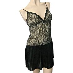 This Is A Very Pretty Black Nightgown From The Oscar De La Renta ’Sugar And Spice’ Collection. It Is A Misses Size X-Small; It Has A Retro ‘Flapper’ Look. The Gown Has A Deep V-Neckline In Front; The Bodice Is A Stretchy Floral Lace With A Nude Silky Lining. The Skirt Is Permanently Pleated All Around And Somewhat See Through. This Is A New Gown With Tags; Msrp Is $64. Nylon/Polyester/Spandex Machine Wash Delicate Black V-neck Sleepwear With Lace Trim, Black Flirty Loungewear Sleepwear, Black Lace V-neck Sleepwear, Flirty V-neck Sleepwear For Night, Flirty Sleepwear With Built-in Bra, Flirty V-neck Sleepwear, Black Sheer V-neck Sleepwear, Black Fitted V-neck Nightgown, Fitted Black V-neck Nightgown