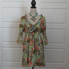 Linen Beach Mini-Dress In An Oversized Paisley Print Nwot - Never Worn Paisley Is Blue, Brown, Green And Red. Very Lightweight - Would Make A Great Beach Cover-Up That You Can Wear As A Dress For A Casual Dinner Gathers And Ties Up Under The Bodice V-Neck Lined With Ruffles Bell Sleeves Generous Size Small 21" Pit To Pit 20" Flat Across The Lower Bodice Wear The Ties Gather 34" Shoulder To Hem Beachwear Vacation Dress With Paisley Print, Beachwear Dresses With Paisley Print For Vacation, Casual Paisley Print Beach Cover-up Dress, Casual Paisley Print Dress For Beach Cover-up, Casual Paisley Print Dress For Beach, Long Sleeve Paisley Print Beach Dress, Beach Dresses With Paisley Print, Brown Paisley Print Summer Dress, Multicolor Paisley Print Dress For Day Out