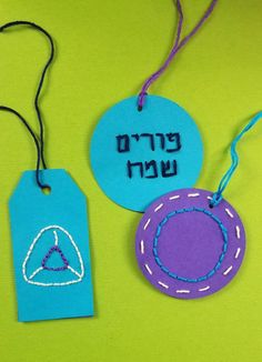 two tags with the words in hebrew on them