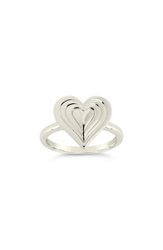 A textured heart-shaped centerpiece steals the show against a polished band ring for a dose of sweetness. 0.5" band width 14k-gold plate or rhodium plate/sterling silver Imported Modern Heart-shaped Anniversary Rings, Modern Heart Shaped Anniversary Rings, Modern Sterling Silver Heart Ring, Modern Heart-shaped Jewelry For Anniversary, Modern Polished Finish Heart Ring For Anniversary, Polished Heart Ring For Anniversary, Beating Heart, Band Ring, Rhodium Plated