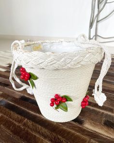 "Sweetest bucket bag ever! Pristine white rope bucket bag with beautiful red cherries peppered on the front. This is such a lovely summer bag. Fits tonnes. Condition: Very good. Some loss of white paint on the trim but not obvious when carried. The lining seems a little \"rough\" around the seams but again, doesn't detract from how lovely this baby is. Label: K& G Charlet Measurements: Top side to side 9\" Bottom side to side 5\" Top to bottom (excluding handle) 8.5\" Handle drop 12\" This item White Bucket Bag For Beach, White Bucket Bag For The Beach, White Bucket Shoulder Bag As A Gift, Cream Summer Bucket Bag, White Bucket Shoulder Bag For Summer, Summer White Bucket Shoulder Bag, Cream Bucket Beach Bag With Braided Handles, White Bucket Straw Bag, White Straw Bag With Braided Handles In Bucket Shape