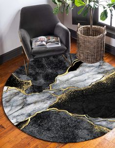 a living room with a chair, rug and plant in the corner on the floor