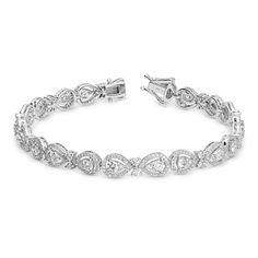 18K White Gold Halo Set Pear Shaped Tennis Bracelet 
Unique yet timeless look just for her, this 2.95 ct. t.w. diamond tennis bracelet is certain to take her breath away. Fashioned in 18K white gold, this timeless design features a brilliant array of shimmering halo-set pear shaped diamonds arranged in a series of links. A sophisticated style, this bracelet is buffed to a polished shine and secures with a tongue and groove clasp
2.95 carat pear shape tennis bracelet
18K white Logo Board, Solitaire Bracelet, Sparkling Jewelry, Diamond Pendants Designs, Jewelry Designing, Jewelry Staples, Bracelet Diamond, Fine Diamond Jewelry, Master Piece