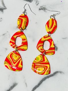 These dangle beauties are so full of color and sparkle. Perfect for that special occasion or statement earring.  So lightweight. You won't even know they're there.  Hypoallergenic and nickel free Stainless steel backs. Handmade Vibrant Drop Earrings, Vibrant Handmade Drop Earrings, Vibrant Dangle Earrings With Ear Wire, Yellow Earrings For Party, Retro Dangle Earrings For Pierced Ears, Yellow Drop Clip-on Earrings For Party, Nickel-free Retro Dangle Earrings, Multicolor Dangle Plug Earrings With Matching Set, Retro Dangle Clip-on Earrings For Gift