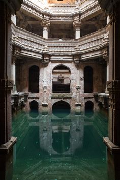 the inside of an old building with water in it