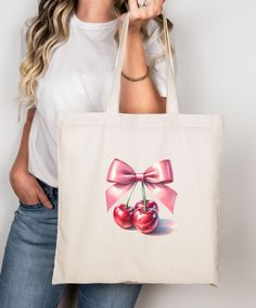 Aesthetic coquette tote bag, pink bow and cherries gift for coquette, canvas tote coquette art print gift for her, cute red cherry design. This 100% cotton bag comes in one size - 15" x 16"- perfect for everyday wear. While the canvas material will show off your designs in great colors, it's durable and will last for years. The bag features 20" handles (made from the same canvas), making it easy to carry even with a week's worth of shopping. .: 100% cotton canvas .: Heavy fabric (12 oz/yd² (406.9 g/m .: Sewn-in label Cute Bag With Bow For Gift, Cute Pink Canvas Bag For Spring, Cute Pink Spring Canvas Bag, Cute Canvas Tote Bag For Gift, Pink Canvas Gift Bag, Feminine Summer Bags For Gifts, Retro Canvas Tote Bag For Gift, Feminine Summer Gift Bags, Cute Pink Canvas Bag For Gift