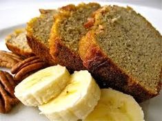 slices of banana bread on a plate with pecans