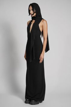 Make them take a second glance. Maxi dress made from luxuriously dense Jersey, featuring an add-on hood that can be draped across the shoulders and over the crown of the head, with plunging halter top neckline. FIT NOTES:Tatianna wears a size Small, 5'9, with a 26" waist.MATERIALS:95% rayon 5% spandexMade in China Top Neckline, The Crown, Halter Top, Dress Making, Black Dress, Take That, Crown, Maxi Dress, Ships