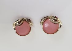 "Cute mid century peachy-pink thermoset clip on earrings by Coro. Stylized pearly pink cherry or apple shape with gold tone leaves.  Each earring measures approximately 7/8\" by 1\".  In very good condition. Bright shiny metal. Previously owned. Please see the photos as they are part of the description.  Do browse our other items as we do combine shipping for savings." Retro Pink Jewelry For Formal Occasions, Formal Pink Round Clip-on Earrings, Pink Retro Style Jewelry For Formal Occasions, Vintage Pink Clip-on Earrings For Formal Occasions, Apple Shape, Apple Shaped, Pink Cherry, Pink Jewelry, Earrings Pink