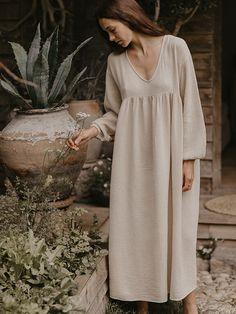 One of our personal favorites, this is truly the most perfect and flattering style for all shapes and sizes. Featuring a deep V-neck, empire waist, billowing sleeves, and a full-flowing skirt, The Meadow Dress is breezy and effortless, just like a wildflower meadow. We adore how it looks with The Woven Mule. For reference, Ashley in our first featured image is 5’7 and is wearing The Meadow Dress in size S (US 4-6). It’s designed to be worn loose and flowy, so we recommend sizing down if you pref Fae Dress, Meadow Dress, The Simple Folk, Clothes Drawing, Loose Clothes, Muslin Dress, Earth Mama, Wildflower Meadow, Butterfly Fairy