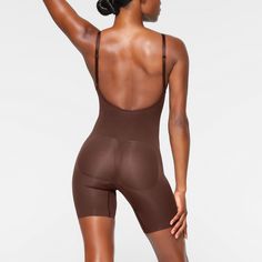 A sculpting bodysuit that sculpts silhouette, cinches waist, and smooth thighs while providing support and lift for your curves. Featuring a deep scoop back that makes it the perfect backless shapewear option. | SKIMS Low Back Mid Thigh Bodysuit | Deep Neutral | XS | Seamless Sculpt Low Back Shapewear, Backless Shapewear, Sculpting Bodysuit, Women's Shapewear, Body Shapers, Cinched Waist, Low Back, Kim Kardashian, Shapewear