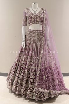 Experience the epitome of bridal elegance with our Premium Lilac/Purple Designer Lehenga Choli from Palkhi Fashion. This exquisite ensemble features a soft net ombre lehenga with a full flair, adorned with an abundance of stones, petite sequins, mirrors, handwork, cutdana, and intricate embroidery work. The matching blouse is equally stunning, enriched with handwork, stones, kundan, sequins, and pearl work. Back of the blouse is very nicely designed. The embroidered dupatta completes the royal e Lilac Lehenga, Ombre Lehenga, Palkhi Fashion, Purple Lehenga, Pearl Work, Lehenga Blouse Designs, Fashion Terms, Bridal Elegance, Net Lehenga