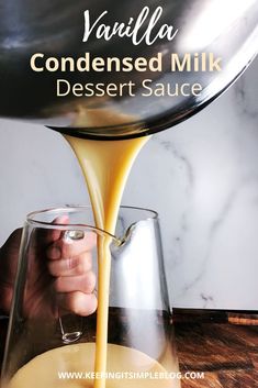 a person pouring liquid into a glass filled with dessert sauce