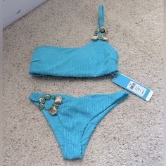 Brand New Beach Bunny Bikini. Embellished One Shoulder Top Size Small. Embellished Skimpy Bottom Size Extra Small. Hygiene Liner Missing As It Peeled Off When I Remove The Tissue Protecting The Embellishment. Beautiful Blue Color, Perfect For Your Next Vegas Pool Party Or Vacation. Embellished Swimwear For Summer Pool, Embellished Swimwear For Summer Pool Season, Embellished Swimwear For Pool And Summer, Embellished Swimwear For Pool And Beach Season, Embellished Swimwear For Summer Beachwear, Embellished Swimwear For Summer, Embellished Beachwear Swimwear For Summer, Embellished Fitted Swimwear For Beach Season, Fitted Embellished Swimwear For Beach Season