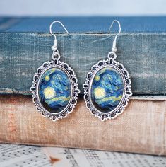 A perfect gift for art lovers! Lovely glass cabochon earrings - 1.5 inch drop They feature the painting by Vincent Van Gogh - 'Starry Night' Metal alloy back and hook, glass cabochon Starry Night Jewelry, Starry Night Earrings, Van Gogh Jewelry, Dove Jewelry, Vincent Van Gogh Paintings, Cabochon Earrings, Van Gogh Paintings, Catholic Jewelry, Art Earrings