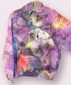 Hand Ice Dyed Tultex Hoodie. Beautiful mix of colors and dye flow. Very soft sweatshirt that fits true to size. If you are very long bodied, this brand may be a little short on you. Made with the finest procion dyes and ONE of a kind. You will be receiving the item in the photos. Wash in warm water with like colors and dry on medium heat. Can be exchanged but NO returns. Hand Dyed Hoodie For Spring, Spring Acid Wash Hand Dyed Hoodie, Spring Hand-dyed Tie Dye Sweatshirt, Fall Multicolor Hand-dyed Hoodie, Tie Dye Hand Dyed Hoodie Sweatshirt, Tie Dye Hand Dyed Sweatshirt For Streetwear, Tie-dye Hand Dyed Sweatshirt For Streetwear, Tie-dye Hand-dyed Sweatshirt For Streetwear, Oversized Tie Dye Hand Dyed Sweatshirt