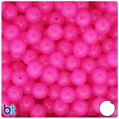 pink plastic beads with holes in the middle