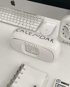 an apple computer and keyboard on a desk