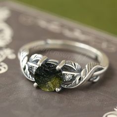 Top moldavite ring 925 sterling silver jewelry, Moldavite Ring, 925 sterling silver, jewellery* Natural moldavite Ring, Authentic Raw Moldavite, Handmade Ring, Christmas gift, Hidden Moldavite Ring, Unique Moldavite Ring, meteorite ring, Adjustable ring Stunning Moldavite Ring, Herkimer Ring, Czech Moldavite, Brass Moldavite Ring, Loose gemstone Rings, Moldavite, Elegant Moldavite Handmade item Dispatches from a small business in India Raw stone Moldavite Healing Properties:- -THE tektite for manifesting -Brings a sense of personal fulfillment -Should NOT be taken lightly, very powerful and strong energy -Brings emotional baggage to the service in order to heal Anniversary Peridot Jewelry In White Gold, Anniversary White Gold Peridot Jewelry, Peridot Rings Stamped 925 For Anniversary, Silver Peridot Jewelry For Anniversary, Peridot Ring With Prong Setting As Gift, White Gold Peridot Rings For Gift, Round Peridot Rings For Gifts, Silver Peridot Jewelry As Gift, Peridot Bezel Setting Promise Ring