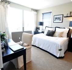 a bedroom with a bed, desk and chair in it's centerpieces